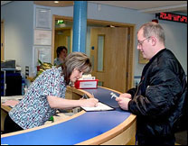 Receptionist signing delivery